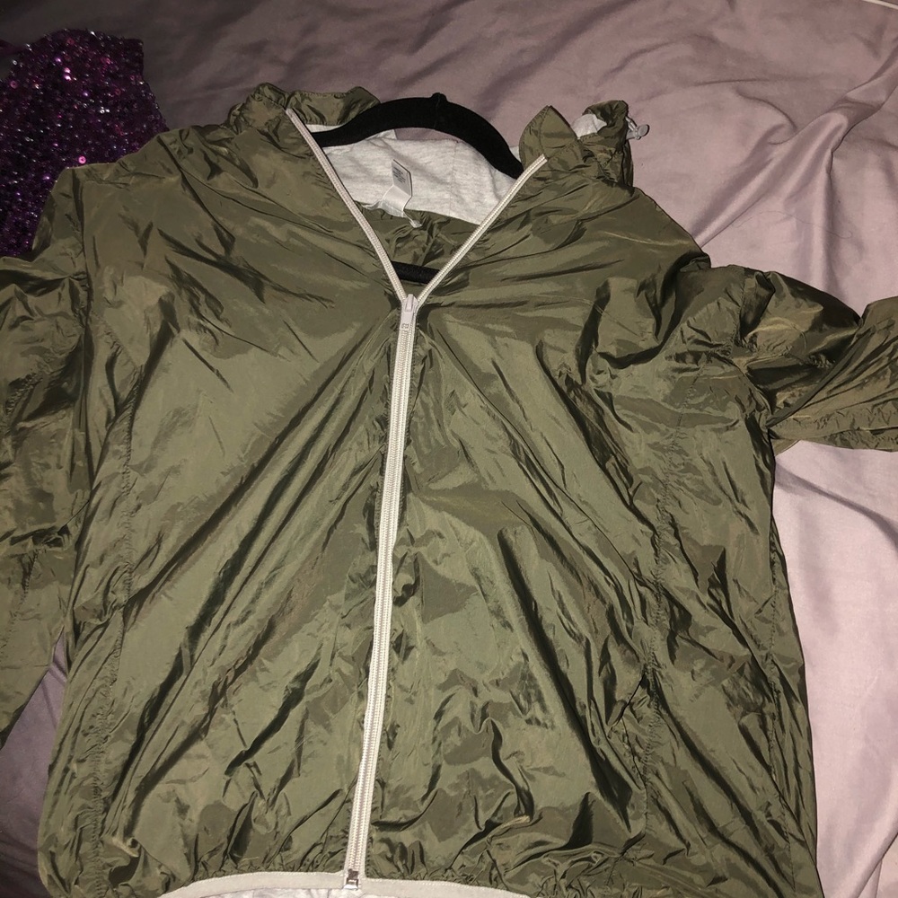 Olive green windbreaker.